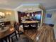 Bright, spacious kitchen with island seating, dark wood cabinets, stainless appliances, and pendant lighting at 855 Bayway Blvd # 908, Clearwater Beach, FL 33767
