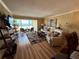 Relaxing living room featuring comfortable seating, hardwood floors, and a stunning beach view at 855 Bayway Blvd # 908, Clearwater Beach, FL 33767