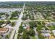 Aerial view of neighborhood showcasing tree-lined streets and well-maintained properties at 878 Franklin Cir, Palm Harbor, FL 34683