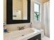 Bathroom featuring a large mirror, updated vanity with white countertop and shower with white curtain at 878 Franklin Cir, Palm Harbor, FL 34683