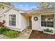 Well-kept home with a welcoming front facade, complemented by manicured landscaping and a neat walkway at 878 Franklin Cir, Palm Harbor, FL 34683