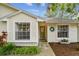 Charming home featuring well-maintained landscaping, enhancing its curb appeal and inviting entrance at 878 Franklin Cir, Palm Harbor, FL 34683