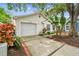 Charming single Gathering home features an attached garage and mature landscaping at 878 Franklin Cir, Palm Harbor, FL 34683