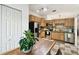 Well lit kitchen featuring stainless appliances, ample wood cabinets, and a dinette at 878 Franklin Cir, Palm Harbor, FL 34683