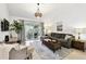 Bright living area featuring comfortable seating, a stylish rug, and natural lighting at 878 Franklin Cir, Palm Harbor, FL 34683