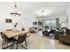 Inviting living room with modern decor, a comfortable sofa, and access to an outdoor patio at 878 Franklin Cir, Palm Harbor, FL 34683