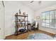 Cozy office space with natural light, a desk, and stylish shelving for organization at 878 Franklin Cir, Palm Harbor, FL 34683