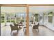 Bright sunroom with comfortable seating and a view of the backyard, creating a tranquil retreat at 878 Franklin Cir, Palm Harbor, FL 34683