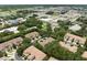 Community aerial view showing multiple residential buildings and lush landscaping in a suburban setting at 897 Lantern Way, Clearwater, FL 33765