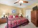 Cozy bedroom featuring bedside tables with lamps and ample natural light at 897 Lantern Way, Clearwater, FL 33765