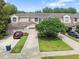 Charming townhome with a tile roof, attached garage, and a well-manicured lawn at 897 Lantern Way, Clearwater, FL 33765