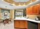 Kitchen featuring light countertops and adjacent breakfast nook with a table and chairs at 897 Lantern Way, Clearwater, FL 33765