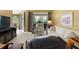 Comfortable living room featuring neutral carpet, lots of light, comfortable seating, and sliding glass door access at 897 Lantern Way, Clearwater, FL 33765