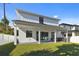 Large backyard features a covered patio and built-in outdoor kitchen, ideal for outdoor entertaining at 905 N Willow Ave, Tampa, FL 33606