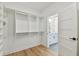 A well-organized walk-in closet with custom shelving, offering ample storage space and easy access at 905 N Willow Ave, Tampa, FL 33606