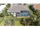 Aerial view of a house showing the screened in pool and landscaping at 916 Bunker View Dr, Apollo Beach, FL 33572