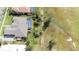 Aerial view of a house showing the screened in pool and yard at 916 Bunker View Dr, Apollo Beach, FL 33572