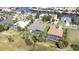 Aerial view of two houses with screened in pools in a waterfront community at 916 Bunker View Dr, Apollo Beach, FL 33572