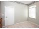 Bright dining area with tile floors, a white door, and a window with light streaming in at 916 Bunker View Dr, Apollo Beach, FL 33572