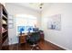 This home office features a stylish wooden desk with dual monitors and comfortable chair at 916 Bunker View Dr, Apollo Beach, FL 33572