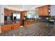 Spacious kitchen with granite countertops, stainless steel appliances, and oak cabinets at 916 Bunker View Dr, Apollo Beach, FL 33572