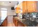 Granite countertop kitchen, perfect for entertaining with under cabinet lighting, backsplash, and stainless steel appliances at 916 Bunker View Dr, Apollo Beach, FL 33572