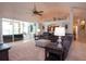 Spacious living room with sliding glass doors to the lanai, high ceilings, and comfortable seating at 916 Bunker View Dr, Apollo Beach, FL 33572