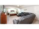 Spacious living room and primary bedroom combined, featuring a comfortable seating area and a king-sized bed at 916 Bunker View Dr, Apollo Beach, FL 33572