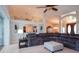 Inviting living room with comfortable gray sectional, high ceilings, and an open floor plan at 916 Bunker View Dr, Apollo Beach, FL 33572