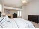 Bright main bedroom featuring a fireplace, dresser, and access to the outdoors at 916 Bunker View Dr, Apollo Beach, FL 33572