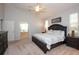 Spacious bedroom with large bed, en-suite bath, and neutral décor at 916 Bunker View Dr, Apollo Beach, FL 33572