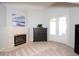 Bright bedroom featuring a fireplace, dresser, and private entry at 916 Bunker View Dr, Apollo Beach, FL 33572