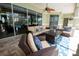 Inviting outdoor living space with comfortable seating and a ceiling fan for relaxing at 916 Bunker View Dr, Apollo Beach, FL 33572