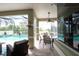 Covered outdoor patio with views of a screened-in pool and backyard at 916 Bunker View Dr, Apollo Beach, FL 33572