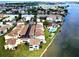 Aerial shot of condominiums near water with community pool and convenient parking at 1 Windrush Blvd # 84, Indian Rocks Beach, FL 33785