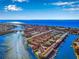 Stunning aerial view of waterfront homes with boat docks and ocean access at 1 Windrush Blvd # 84, Indian Rocks Beach, FL 33785