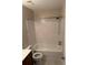 Cozy bathroom featuring tiled shower and floors and updated fixtures at 1 Windrush Blvd # 84, Indian Rocks Beach, FL 33785