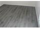 Bedroom with gray flooring that includes a wall outlet and base trim at 1 Windrush Blvd # 84, Indian Rocks Beach, FL 33785
