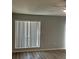 Bedroom featuring large window offering generous natural light and modern floors at 1 Windrush Blvd # 84, Indian Rocks Beach, FL 33785
