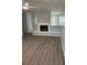 Cozy living room featuring modern floors, fireplace, and lots of natural light at 1 Windrush Blvd # 84, Indian Rocks Beach, FL 33785