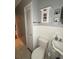 Bathroom features a toilet, vanity, storage cabinet and a closet for additional space at 114 N Arcturas Ave, Clearwater, FL 33765
