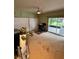 Large bedroom with a ceiling fan, plush carpet, large closet doors, and sliding glass doors to the outside at 114 N Arcturas Ave, Clearwater, FL 33765