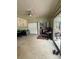 Large bedroom with a ceiling fan, plush carpet, large closet doors, and sliding glass doors to the outside at 114 N Arcturas Ave, Clearwater, FL 33765