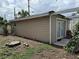 View of the exterior building with a patio and minimal landscaping at 114 N Arcturas Ave, Clearwater, FL 33765