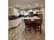 Well-lit kitchen with modern appliances, stylish countertops and a cozy dining area at 114 N Arcturas Ave, Clearwater, FL 33765