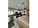 Spacious kitchen features stainless appliances, white cabinets, and modern lighting fixtures at 114 N Arcturas Ave, Clearwater, FL 33765