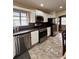 The kitchen is equipped with sleek stainless steel appliances and white cabinets at 114 N Arcturas Ave, Clearwater, FL 33765