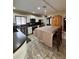 View of the kitchen with stainless steel appliances and a long table with chairs at 114 N Arcturas Ave, Clearwater, FL 33765