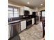 The kitchen features stainless steel appliances and white cabinets at 114 N Arcturas Ave, Clearwater, FL 33765