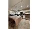 Bright kitchen featuring white cabinets, stainless steel appliances, brown countertops and unique hanging lights at 114 N Arcturas Ave, Clearwater, FL 33765